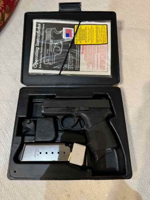 Kahr PM9 with two mags in box. 